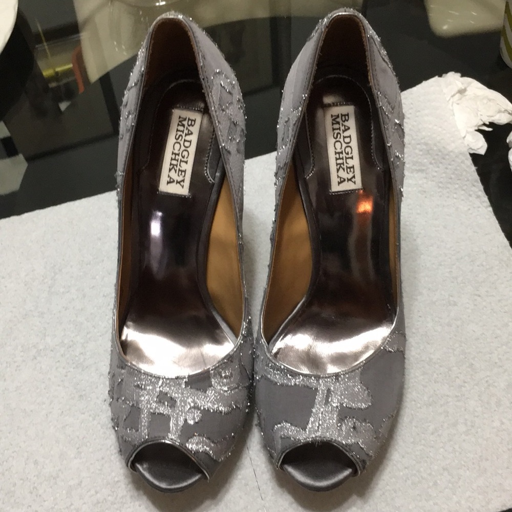 Beautiful Silve color shoes. Discounted at 20%.
